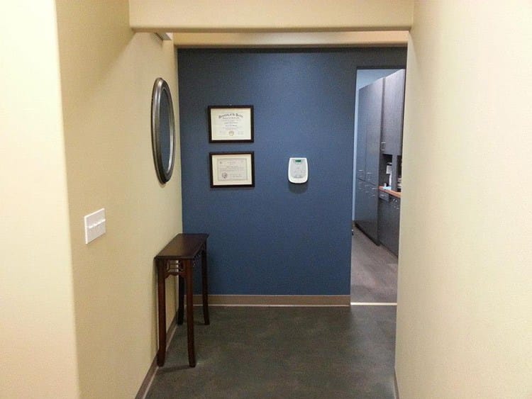 Hallway with diplomas on wall