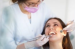 Woman receiving dental exam