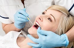 Woman receiving dental treatment