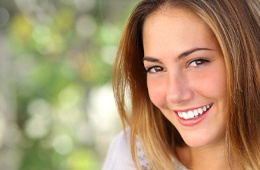 woman smiling after working with a cosmetic dentist in Campbell