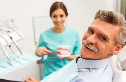 : a patient smiling with dentures in Campbell