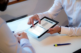 An insurance agent discussing dental insurance with a patient