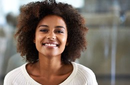 Woman in white shirt smiling