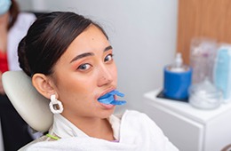 Woman receiving fluoride treatment in Campbell dental office