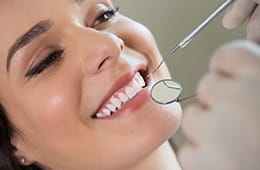 Woman receiving dental exam