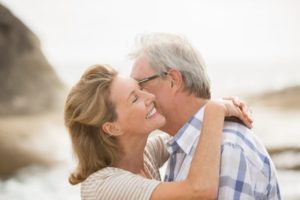 two older people kissing while on a date